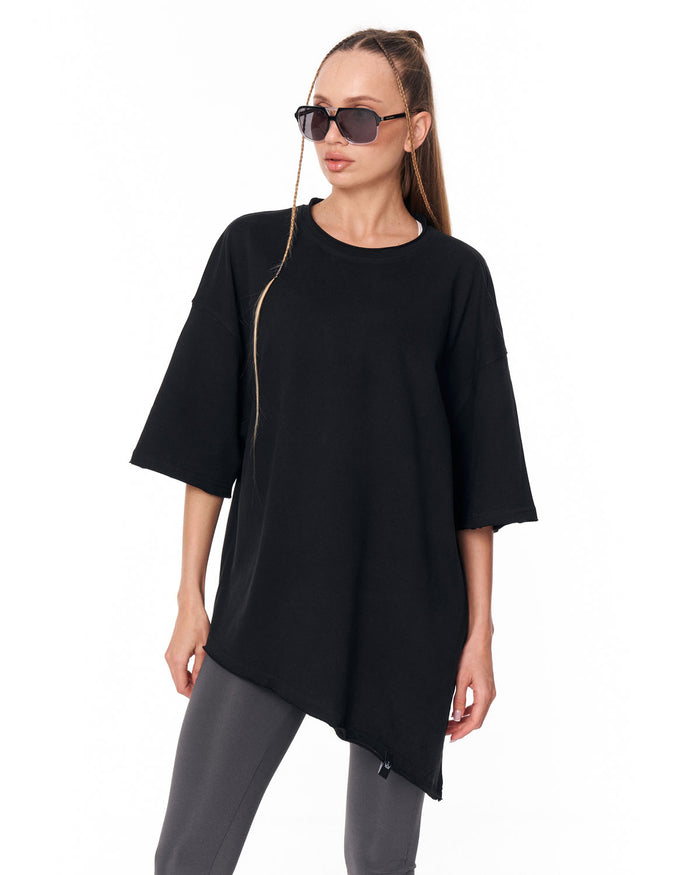 Women's Oversized Asymmetrical Black T-Shirt styled with grey leggings