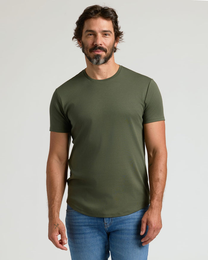 Man wearing True Classic Men’s Pima Cotton Blend Curved Hem Crew.