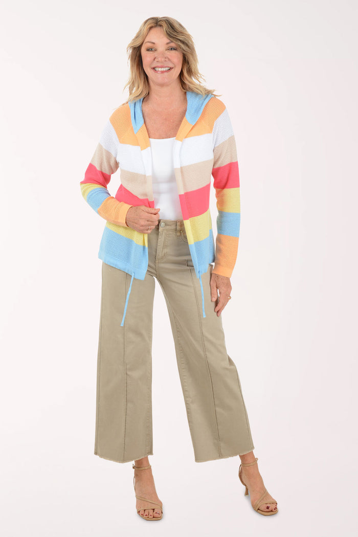 A woman wearing a flared brown crop pant.