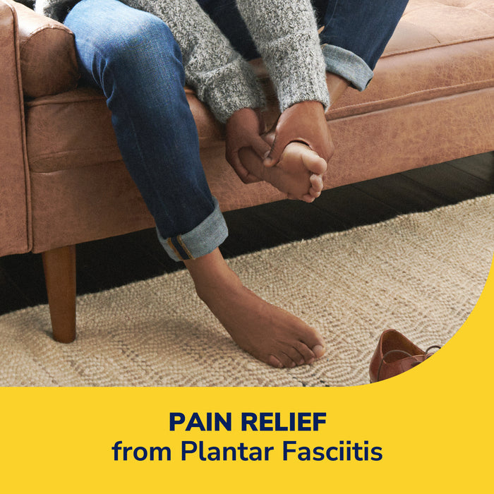 Plantar fasciitis pain patches shown on resting feet on a living room couch