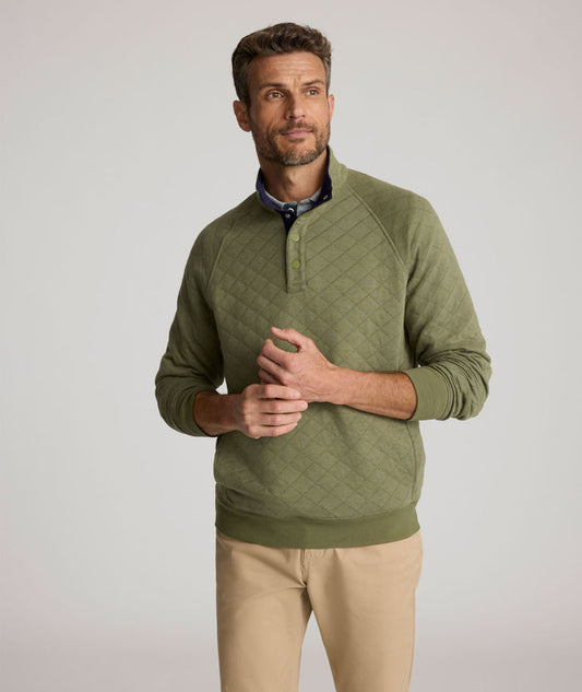 Model is wearing UNTUCKit Garrison pullover in olivine.