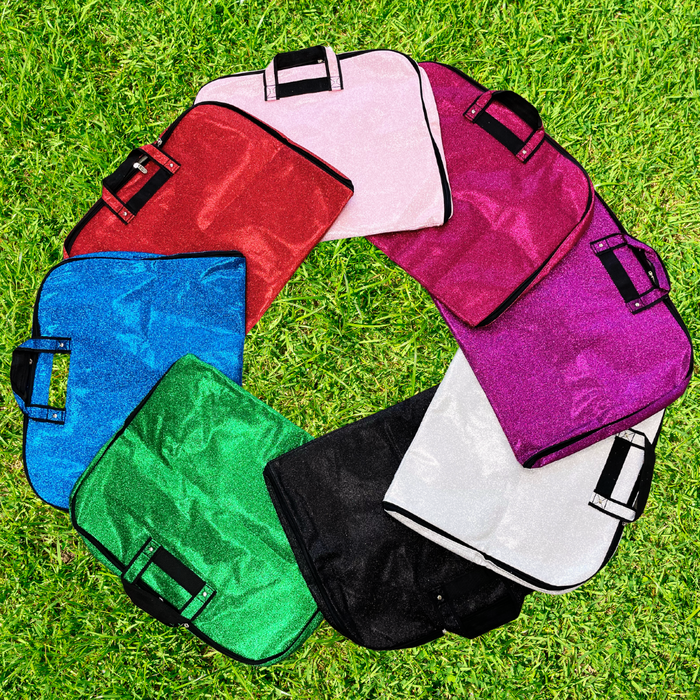 silver glitter garment bag, NGIL garment bag, dance garment bag, cheer garment bag, travel garment bag, competition garment bag, dancewear storage bag, wrinkle-free travel bag, glitter travel bag, dancer travel bag, cheerleader travel bag, monogram garment bag, foldable garment bag, lightweight dance bag, dance competition bag, glitter cheer bag, garment bag with hook, glitter clothing bag, sparkly garment bag, stylish travel bag, costume storage bag, dance outfit bag, cheer uniform bag