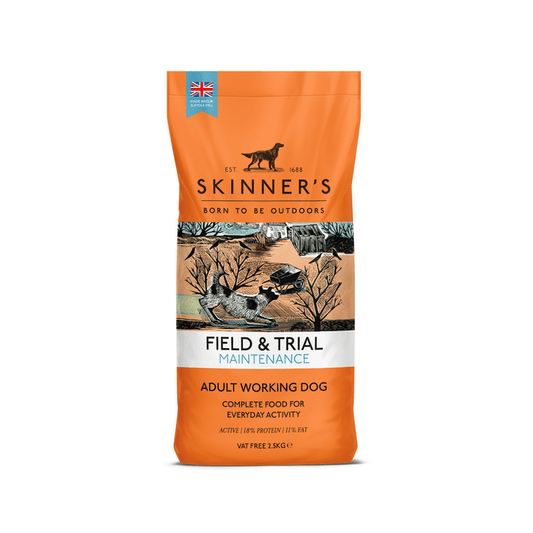 A bag of Skinner's Field & Trial Maintenance dog food for adult working dogs, featuring a orange bag with a central illustration of a lake, trees, and dogs.