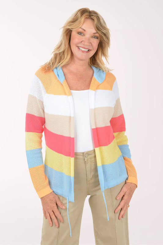 Woman wearing a colorful striped sweater on a white background