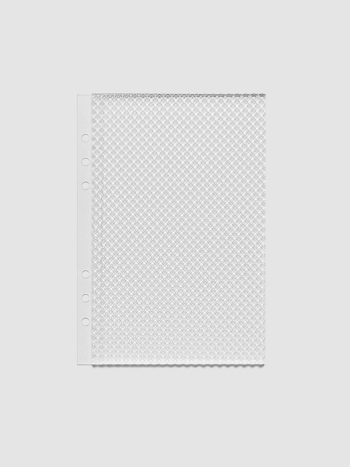 Clear, textured Studded Planner Dashboard in the size A5, on a neutral background.