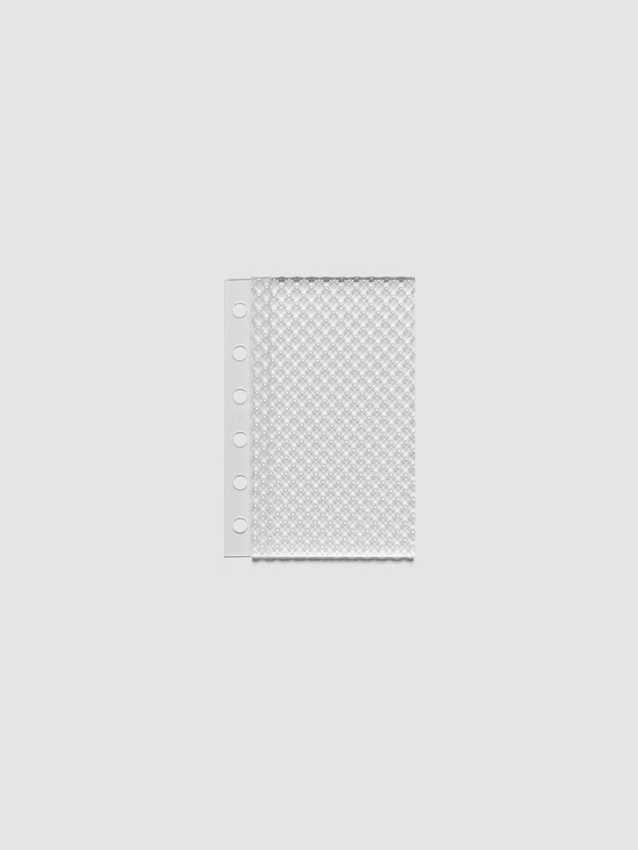 Clear, textured Studded Planner Dashboard in the size Pocket, on a neutral background.