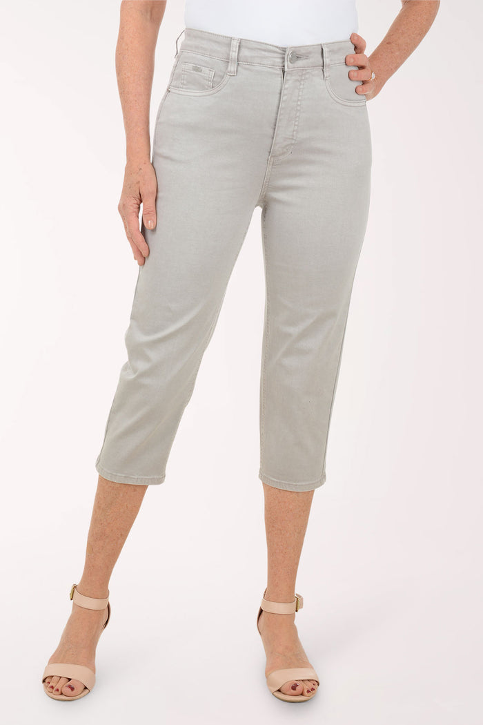 Woman wearing a grey capri pant.