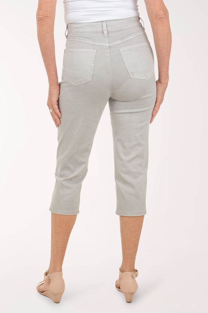 Woman wearing a grey capri pant.