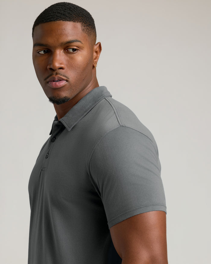 Young man wearing Tall Classic Polo 3-Pack, gray fitted shirt.