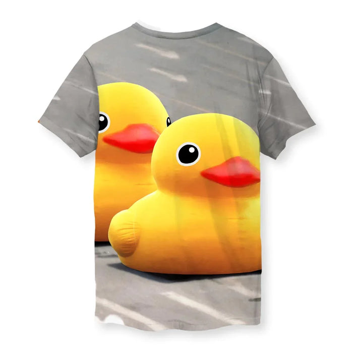 Tank Man Ducky T-Shirt - The jarring contrast of sunbeam yellow (#FFD900) bath toys occupying the exact compositional space of military armor on a grainy asphalt gray (#7A7C7E) roadway.