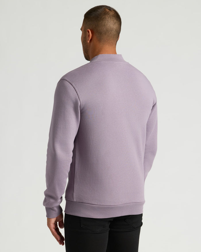 Thistle Fleece Bomber Jacket worn by man, back view.