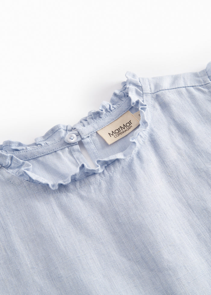 Sleeveless light blue top for children with lace details