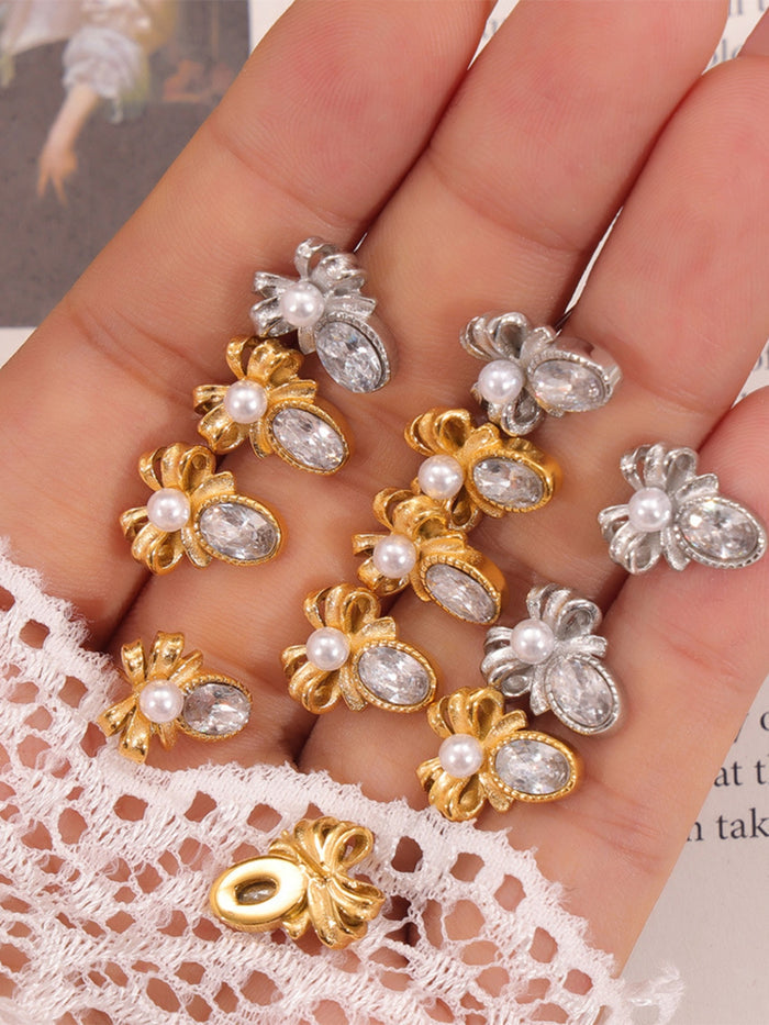 Trendsi titanium steel bow stud earrings in gold and silver with pearl and crystal accents