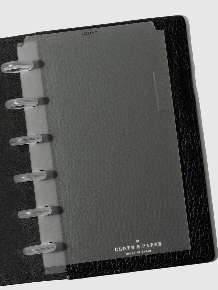 Black foil divider displayed in a black leather planner.