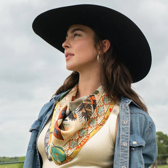 Woman in denim jacket and Indian Chief fringe scarf