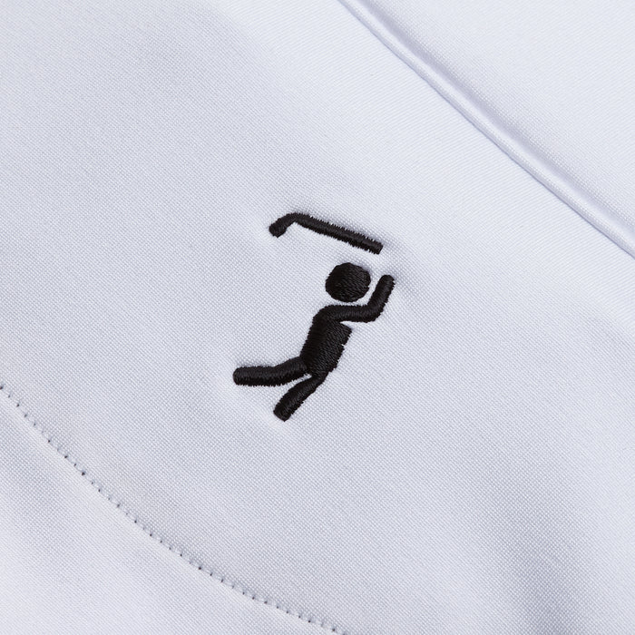 Close-up of the White - Q-Zip’s fabric shows a neat black stitched golfer silhouette, underscoring its golfing theme. The athletic fit and precise embroidery highlight the garment’s stylish texture and quality.