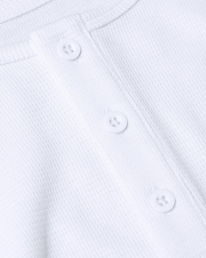 White Waffle Long Sleeve Henley with three-button placket detail.