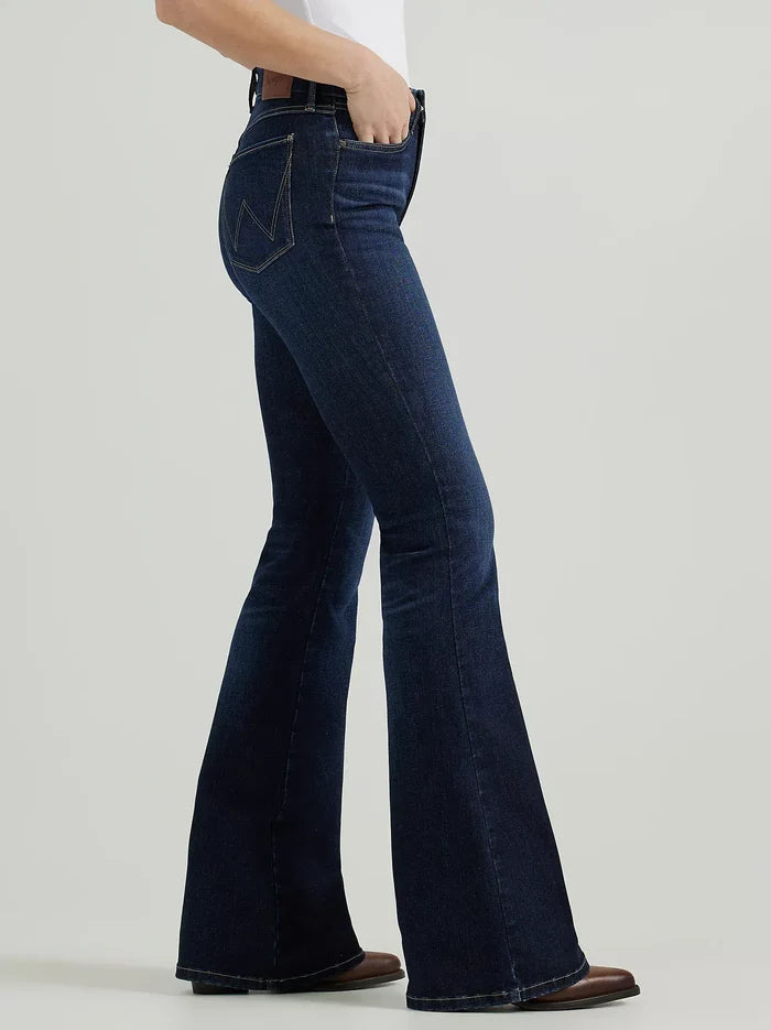 Woman wearing dark wash flared jeans.