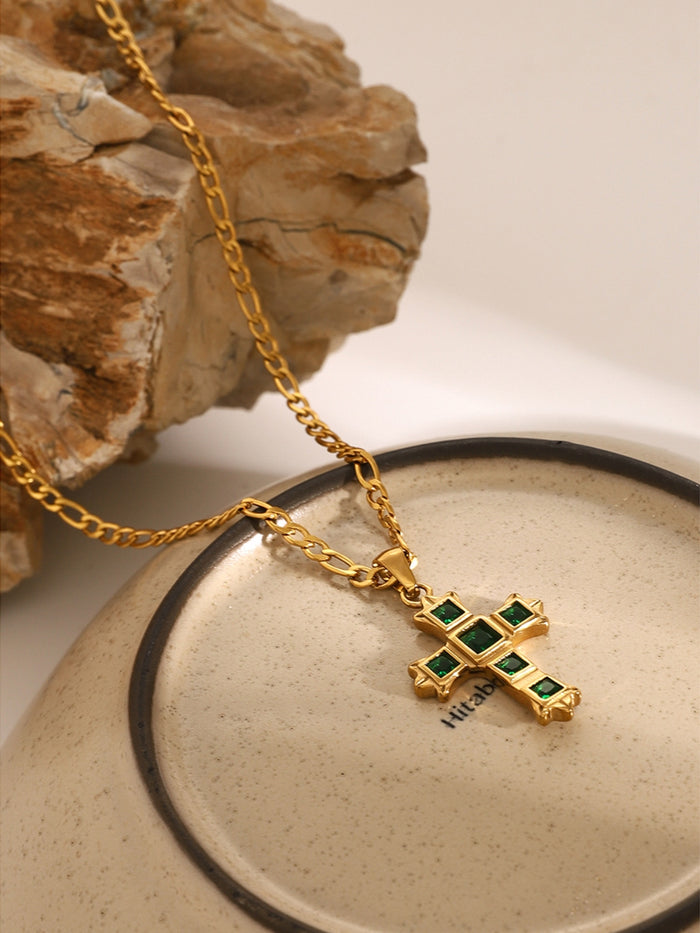 Gold chain necklace with zircon cross pendant for women featuring green stones inlaid in gold setting